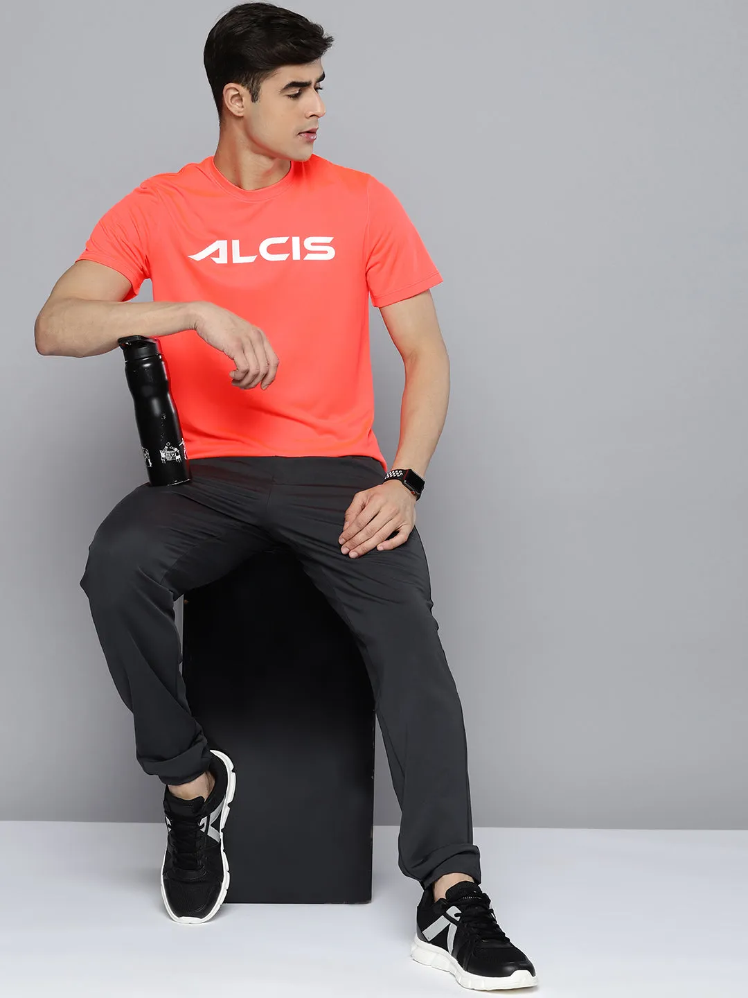 Alcis Men Coral Orange Brand Logo Printed Dry Tech T-shirt