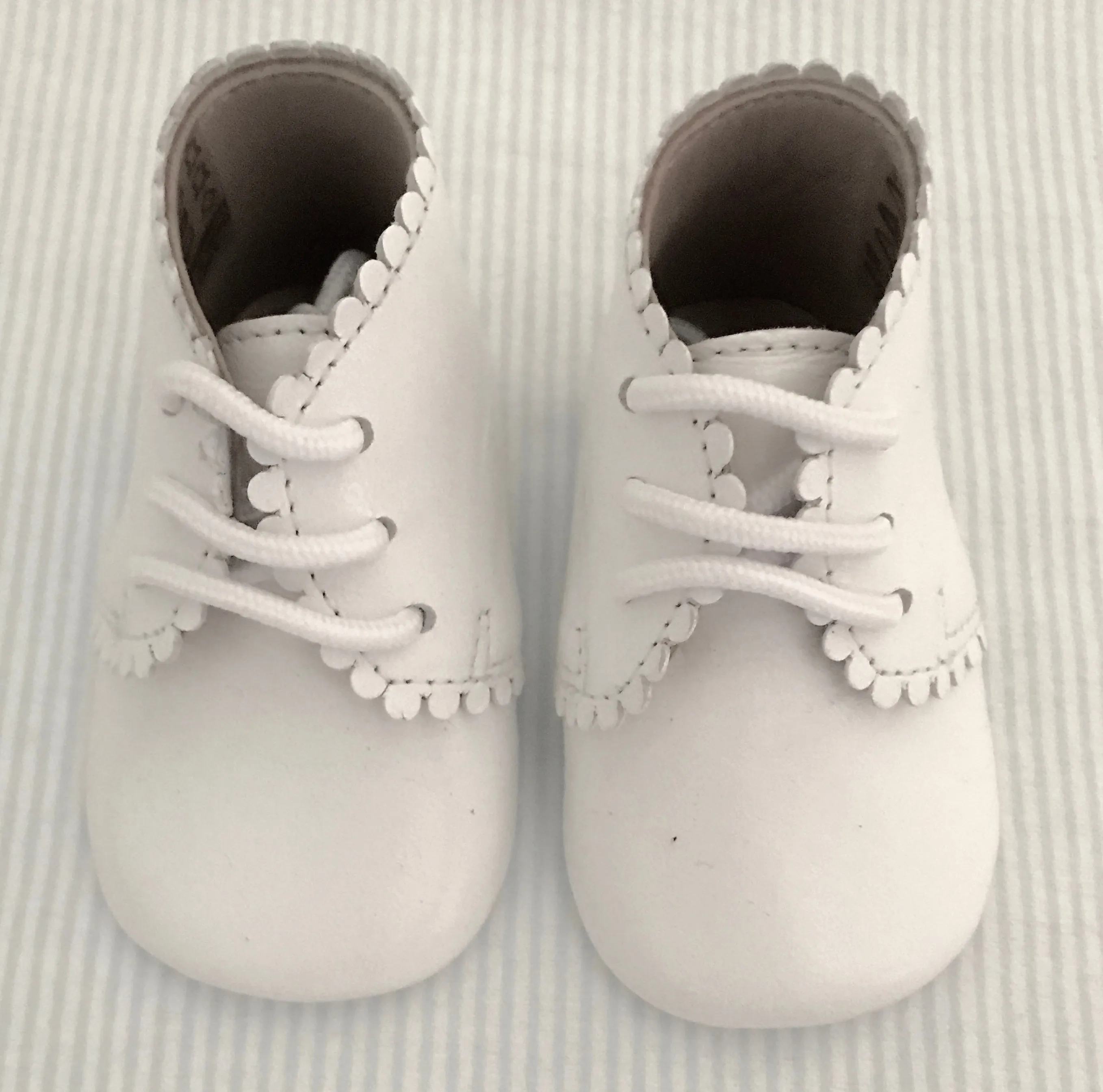 Scalloped baby shoe