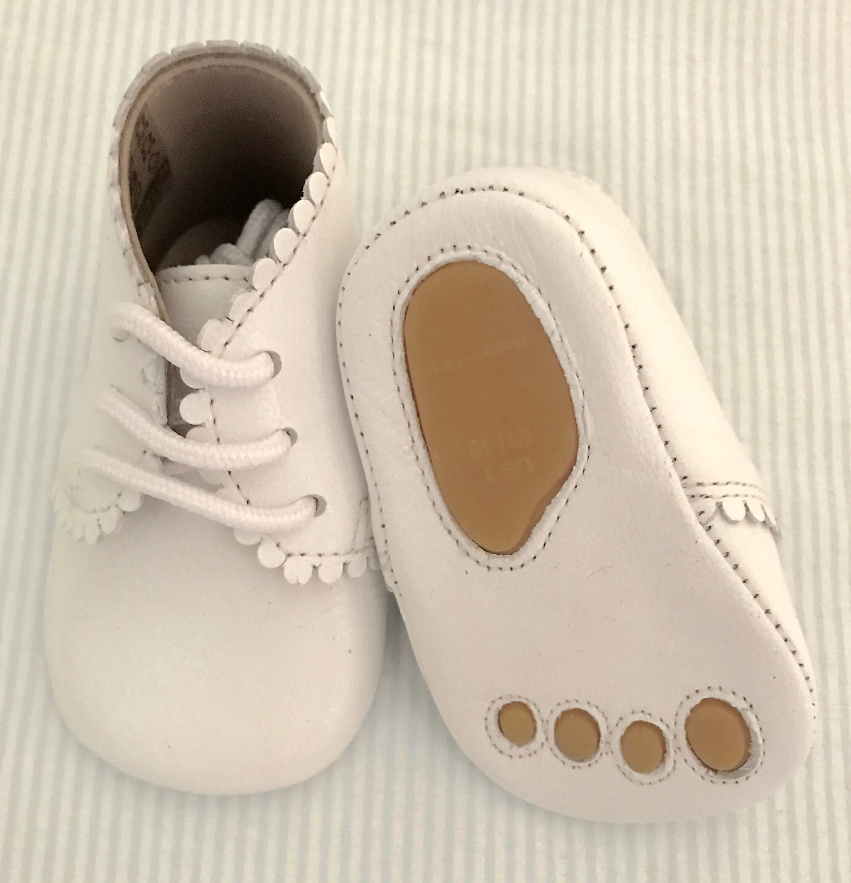 Scalloped baby shoe